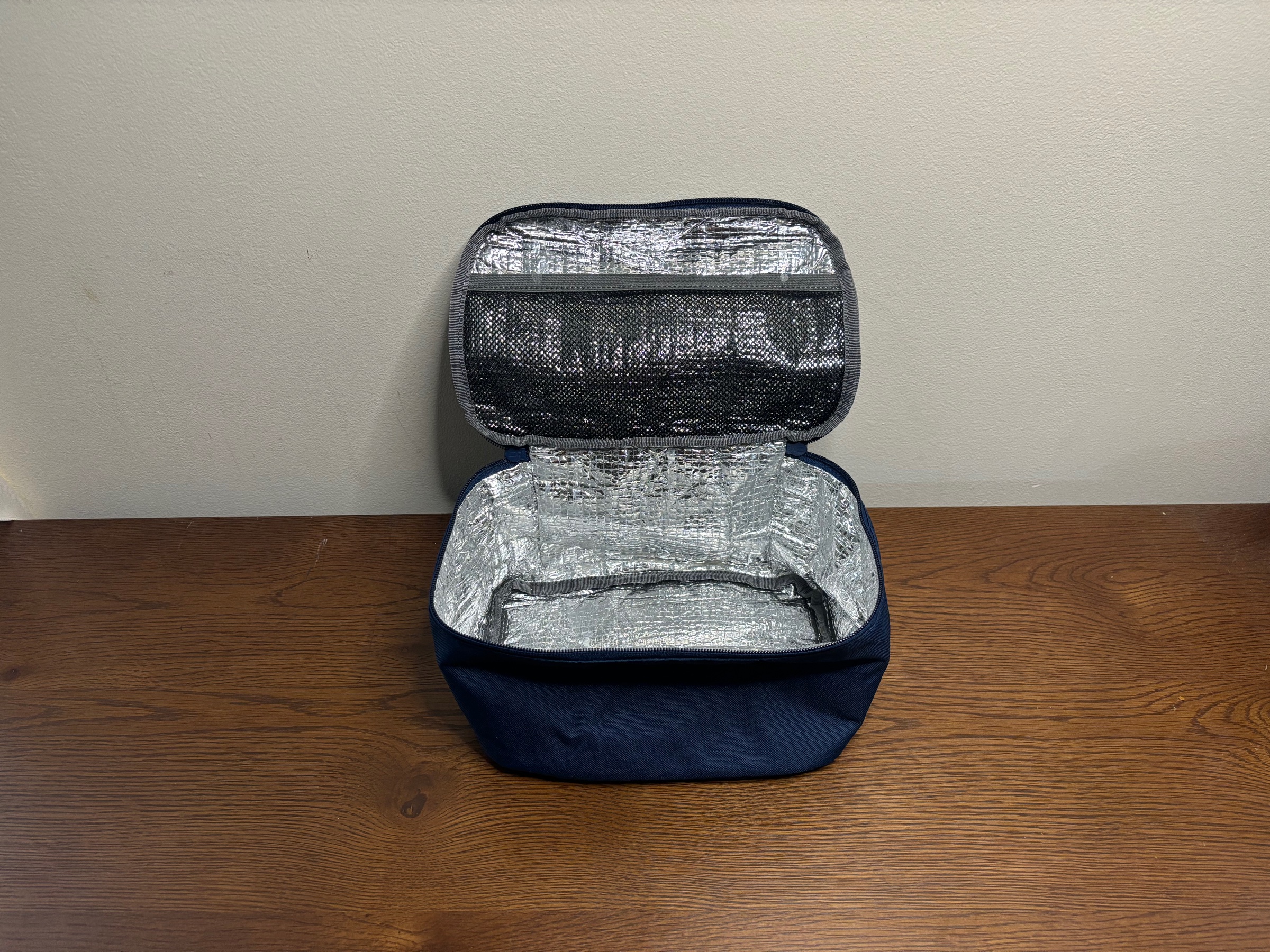 The Expedition diaper bag’s thermal-lined cooler compartment